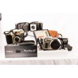 A quantity of cameras: Canon EOS 1x camera plus Canon G9 Powershot, Minox 35GT, Olympus camera and