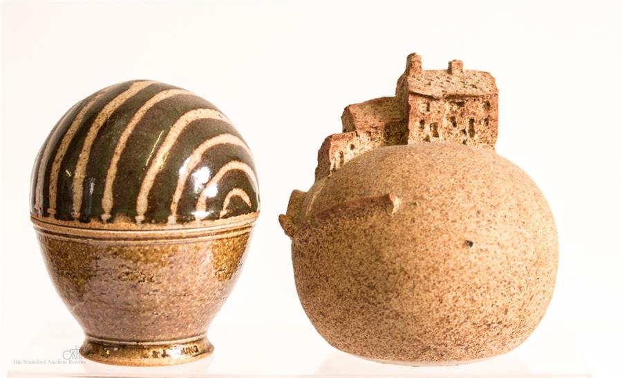An ovoid pottery trinket box by J Young and stoneware model of cottages on a hill.