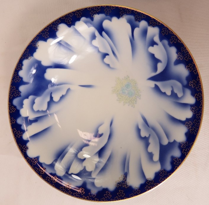 A Japanese Fukagawa porcelain dish with original label and character mark, blue and white.