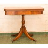 A mahogany fold over card table, with green baise lining.