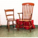 A 19th century Farmhouse comb back armchair, with residual original paintwork, turned legs and H-