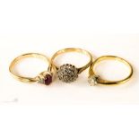 Three yellow metal dress rings, one cluster ring, one solitaire and one pink paste.