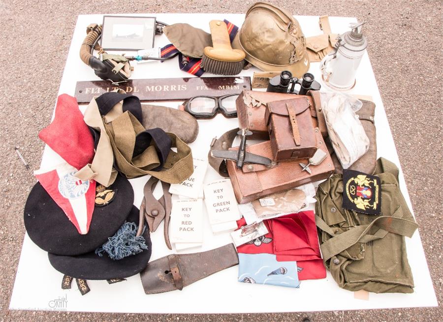 A large group of miscellaneous military collectables to include: binoculars, leather pouches,