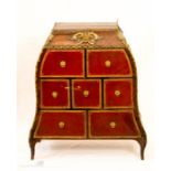 A French table cabinet with red leather fronted drawers and gilt metal mounts and handles, 80 by