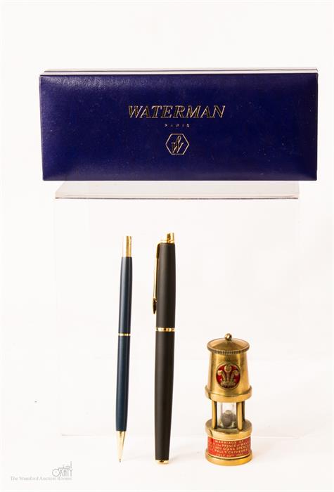 A Waterman fountain pen and Parker pencil.