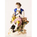 A German porcelain figure of a man with bird in a cage, anchor mark to base.