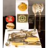 A group of items to include cigarette case, compacts, silver plated flatware etc.