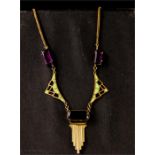 An Art Deco green enamel and amethyst necklace.