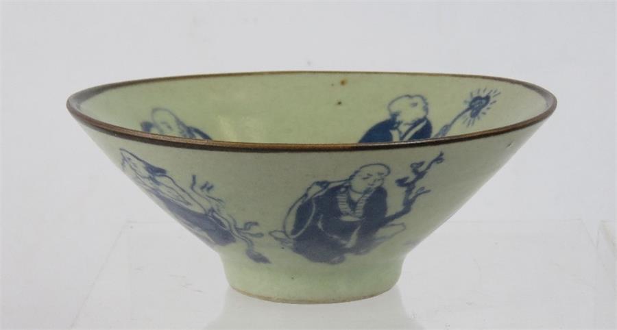 A Chinese celadon glazed bowl, depicting figures, six character mark to base