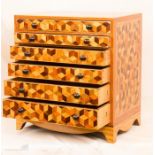 A table top marquetry six drawer chest, 40 by 45 by 28cm.