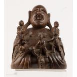 A hardwood carved Buddah, 20cm high.