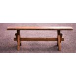 A pine hall bench, A-form ends uniting the long stretcher.