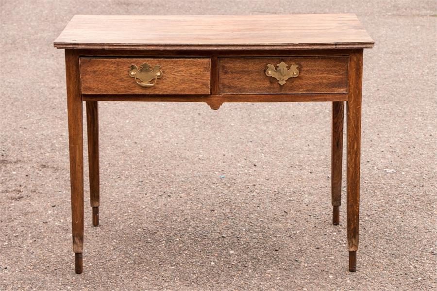 A 19th century oak two drawer side table. - Image 2 of 3