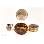 A group of tortoiseshell oval dish, silver plated tortoiseshell pill box, silver dish, and miniature