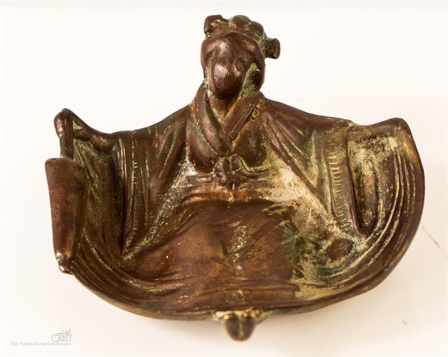 Erotica: a bronze dish in the form of a Geisha girl, with bare bottom underside, with residual