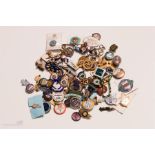 A large group of enamelled badges to include race course members badges, Turkish Olympic badge and