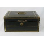 A late 19th century leather clad work box with tooled and gilded decoration.