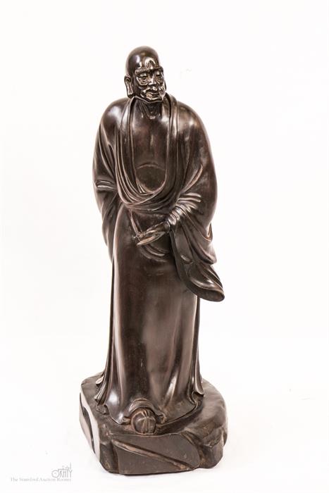 A carved hardwood figure of Lohan.