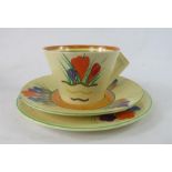 A Clarice Cliff Bizarre pattern cup and saucer and plate.