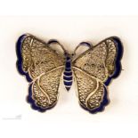 A silver and enamel butterfly brooch.