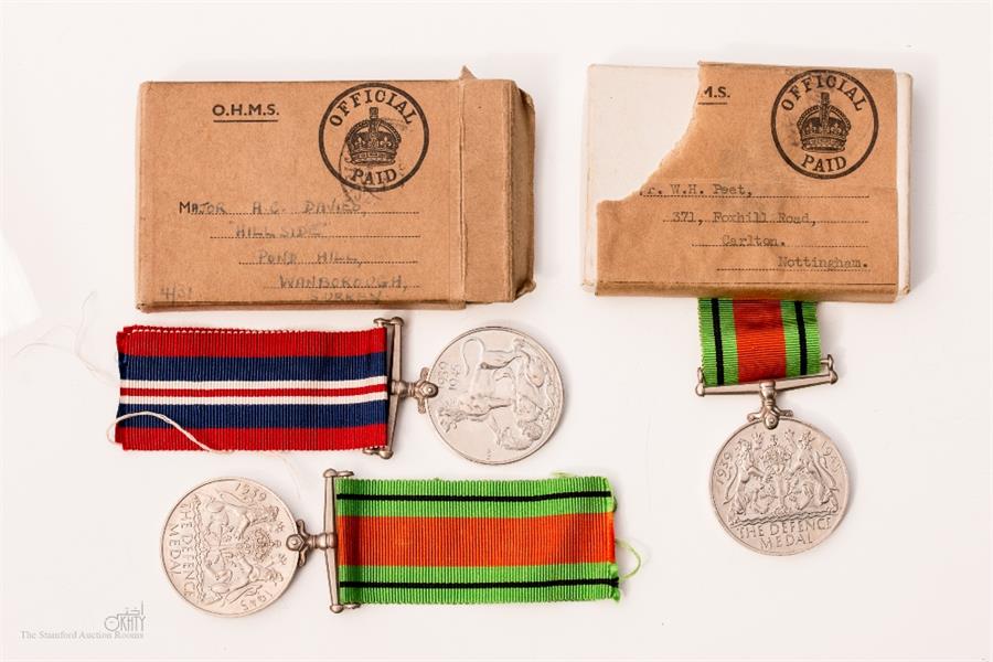 Two boxed WWII pair and Defence medal.