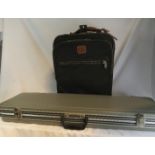 A travel bag, and gun case.
