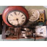 A group of clock parts and clocks including a mahogany wall clock.