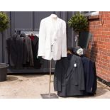 A group of six suit jackets and faux leather jacket, and Ralph Lauren trousers.