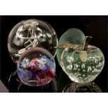 A Caithness paperweight and three others.