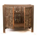 A rosewood Indian table inlaid with brass, folding base.