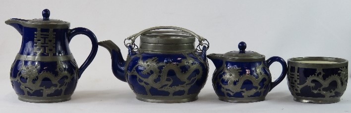 A Chinese ceramic and pewter tea set, circa 1920s, comprising teapot, hot water pot, cream and sugar