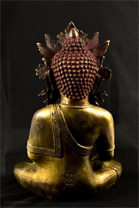 A bronze Buddhist deity, with some original gilding and paintwork, serene pose. - Image 3 of 3