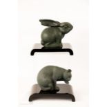 A Franklin Mint cat and rabbit, both raised on perspex black stands, circa 1980.