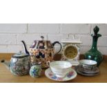 A mixed group of items to inlcude Coalport clock, green glass decanter, tea pots etc.