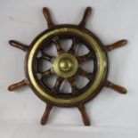 A ships wheel with brass end cap, circa 1880.