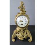 A French gilt bronze mantle clock, Paris, with enamelled painted Roman numeral dial.