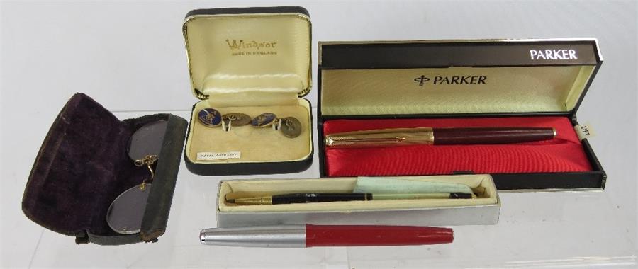 A pair of pince nez, Royal Artillery cuff links, boxed Parker pen, and Parker pen with 14ct gold nib