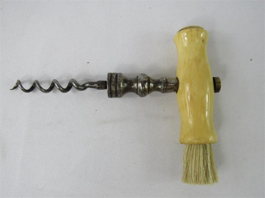 A late 19th century cork screw with bone handle.