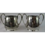 A pair of Elkington & Co silver plated cups.