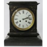 A slate mantle clock with Roman numeral dial.