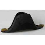A bicorn antique hat.
