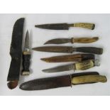 A group of various hunting knives.