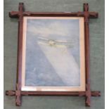 An Arts & Crafts oak frame containing an aeroplane print.