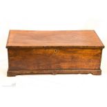 An 18th century oak box with candle box interior.