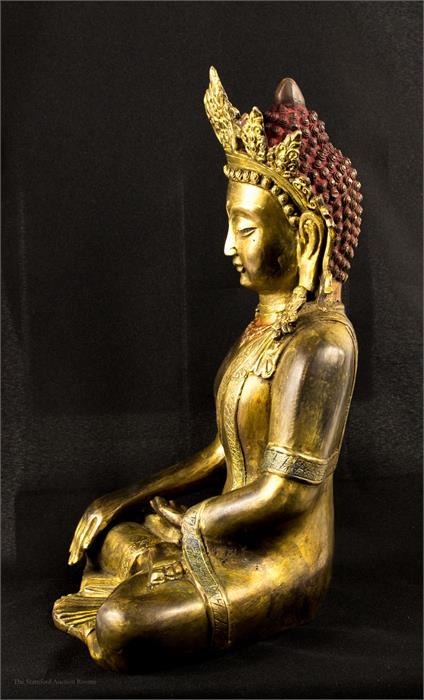 A bronze Buddhist deity, with some original gilding and paintwork, serene pose. - Image 2 of 3