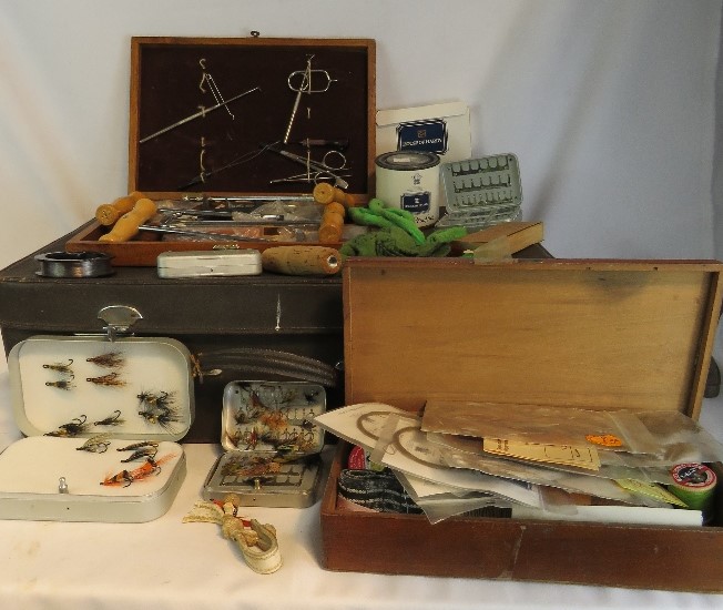 Four boxes of fishing accessories, to include flies, fly making kit, vintage boot pulls, all in