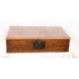 An 18th century oak bible box, carved with initials Mr and dated 1702, with iron hasp and lockplate.