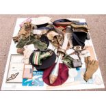 A box of miscelleaneous militaria hats, brass model aeroplane, mortar shell converted to a lamp etc.