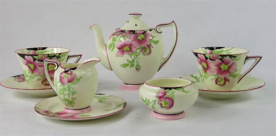 A Royal Doulton Rosea pattern tea for two, including two cups and saucers, tea pot, sugar bowl,