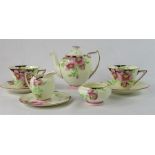 A Royal Doulton Rosea pattern tea for two, including two cups and saucers, tea pot, sugar bowl,